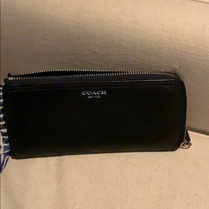 Black and silver Coach wallet
